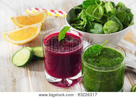 Freshly Squeezed Vegetable Juices On A Wooden Table