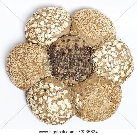Multigrain brown bread in shape of flower isolated on white