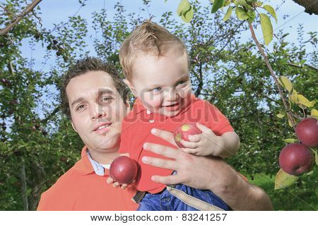 Father giving piggyback ride to his son
