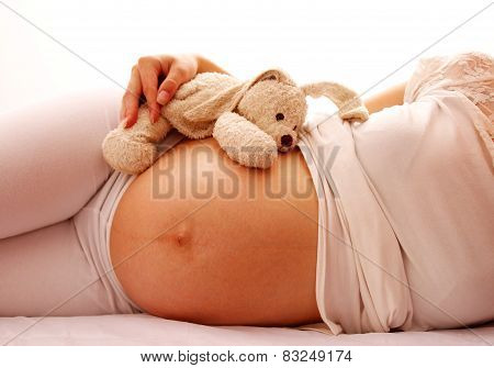 Pregnant Woman On A White Background