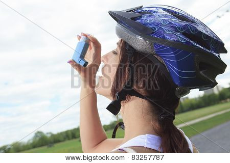 A Roller skating girl in park rollerblading on inline skates.