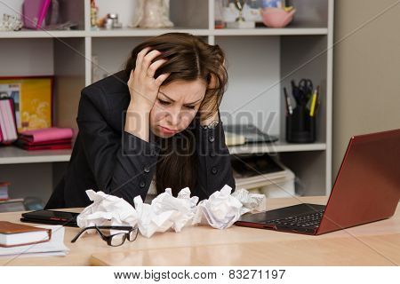 The Girl At A Computer With Bunch Crumpled Sheets Of Paper
