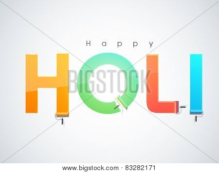 Glossy colorful text Holi drawn by paint roller brush on grey background for Indian festival of colors celebration.