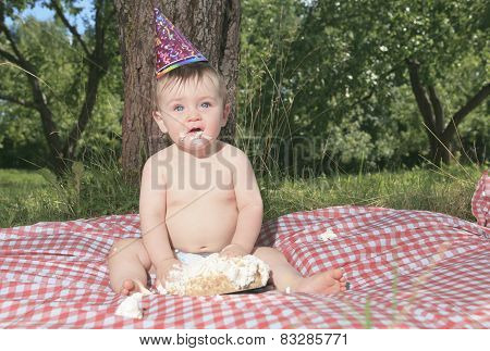 Baby girl celebrating her first bithday with gourmet cake