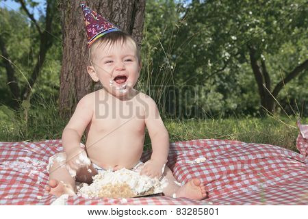 Baby girl celebrating her first bithday with gourmet cake