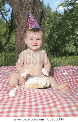 Baby girl celebrating her first bithday with gourmet cake