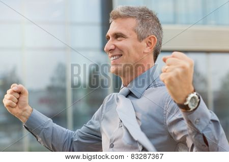Closeup Of Exultant Businessman Clenching His Fist Outdoor