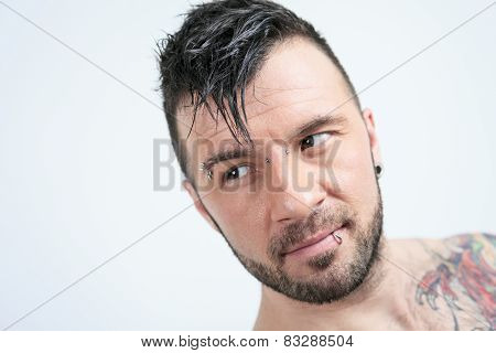 A sexy portrait of a man over a gray background