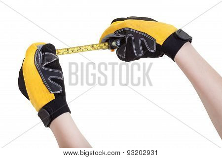 Builder Hands In Safety Glowes With Measuring Tape