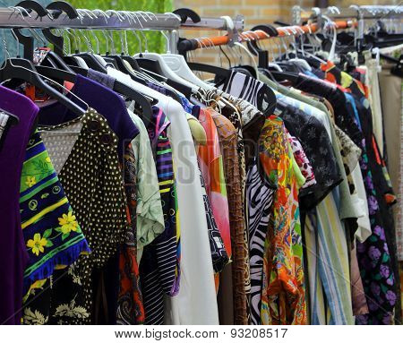 Used Vintage Clothes Hanging In The Market