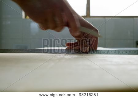 Measuring Croissant Dough To Cut