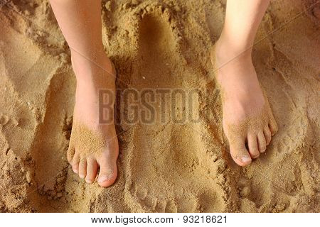 Kids Foot On The Beach Sand As A Therapy Against Patypodia