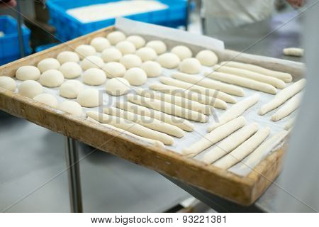 Baker Prepping Freshly Made Dough For Rolls