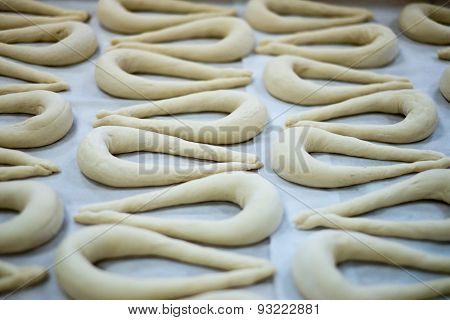 Fresh Pretzel Or Brezel Dough On Wax Sheet