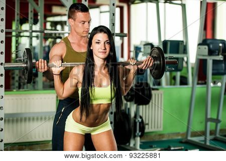 Fitness Youple Workout - Fit Mann And Woman Train In Gym