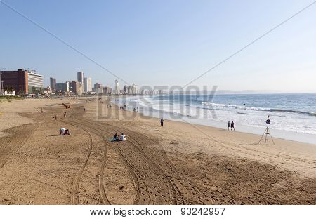 Early Morning Tyre Tracks On Beach In Durban