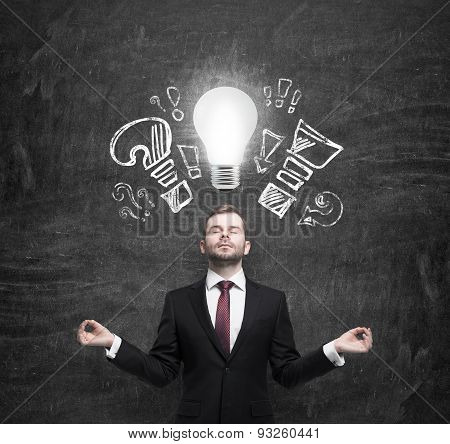 Mediating Manager Ponders About New Business Ideas. A Light Bulb As A Concept Of New Ideas.