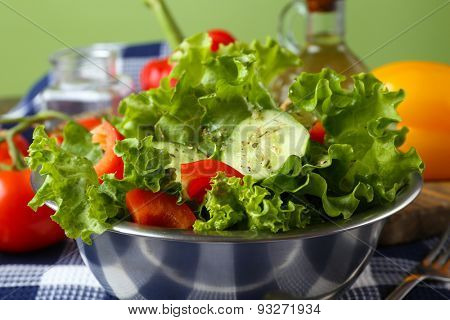 fresh vegetable salad in bowl on table close up