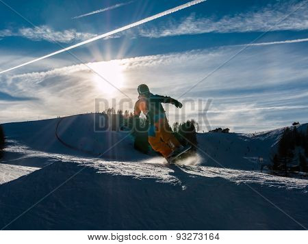 Freestyle Snowboarder With Helmet In Snowpark