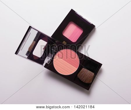 A huge set of beauty cosmetics or make-up laid flat and askewed.