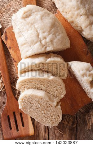Boiled Knedliks With Sour Cream Macro On The Table. Vertical Top View