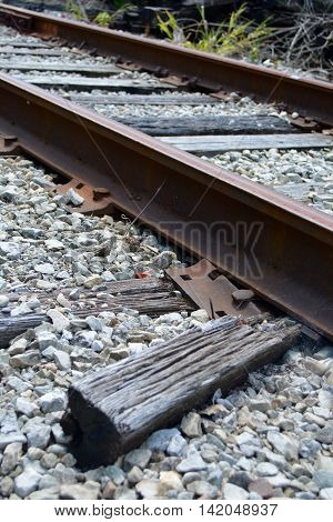 broken rail road ties under rail lines
