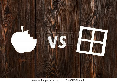 Paper bitten apple and window on wooden background. Abstract conceptual image