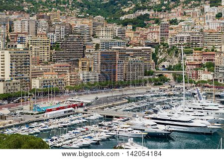 MONACO, MONACO - JUNE 17, 2015: View to the buildings and marina of Monte Carlo from the viewpoint at the Prince's Palace of Monaco (Monaco - Ville) in Monaco, Monaco.