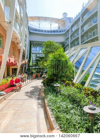Barselona, Spaine - September 06, 2015: Royal Caribbean, Allure of the Seas sailing from Barselona on September 6 2015. The second largest passenger ship constructed behind sister ship Oasis of the Seas. Passengers sitting at Central Park