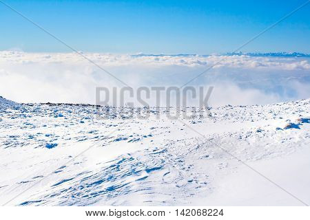 Panorama of white snow mountain landscape with fog and clouds