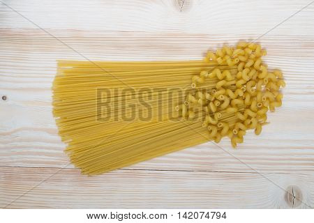 raw spaghetti pasta, on the beautiful wooden board
