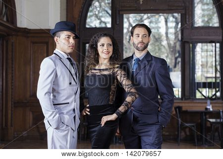Welldressed Tango Dancers Looking Away In Restaurant