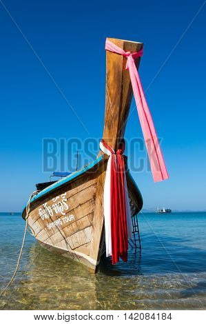 CRABI PROVINCE THAILAND - FEBRUARY 04 2015: Traditional thai long tail boat waiting for tourists to travel to beautiful islands in Thailand