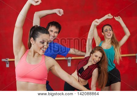 Woman Practicing Zumba With Friends