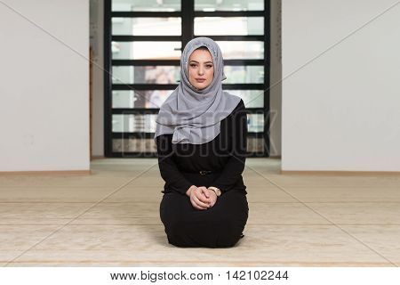 Young Muslim Woman Praying In Mosque