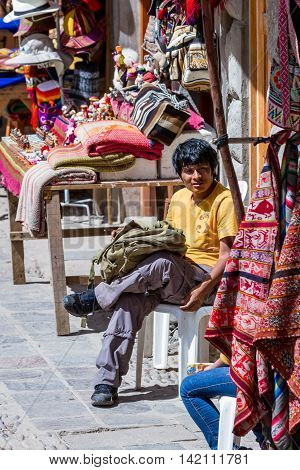 Man Selling Peruvian Bags And Other Souvenirs