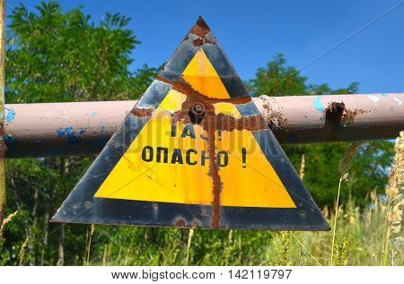 Gas -danger sign (RU). Ukrainian gas pump station entrance.August 5, 2016.Near Kiev,Ukraine