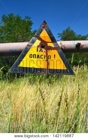 Gas -danger sign (RU). Ukrainian gas pump station entrance.August 5, 2016.Near Kiev,Ukraine