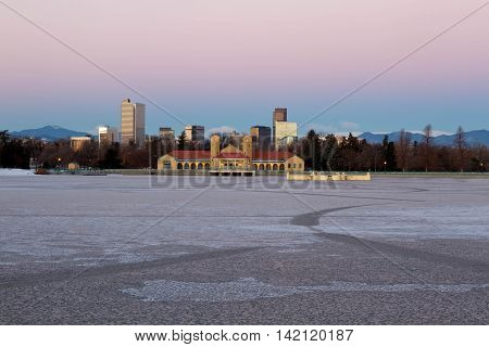 Eary morning sunrise on Denver City Park in the winter with a frozen lake