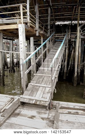 The wooden ramp climb up from ferry landing to the second floor of river side restaurant.