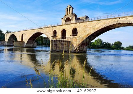 a view of the Pont Saint-Benezet or Pont d'Avignon bridge, in Avignon, France, over the  Rhone River