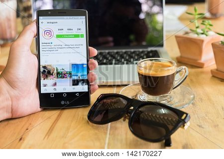 CHIANG MAI THAILAND - AUG 06 2016: A man hand holding lg g4 with instagram application. Instagram is largest and most popular photograph social networking.