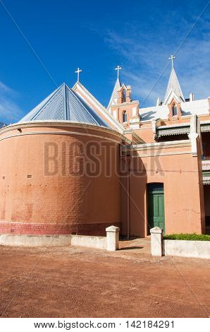 NEW NORCIA,WA,AUSTRALIA-JULY 15,2016: Rear view of St. Gertrude's Ladies College with spanish gothic architecture under a blue sky in the monastic town of New Norcia, Western Australia.