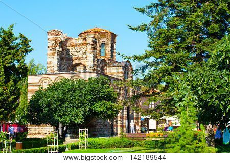 Nessebar, Bulgaria - July 25, 2016: Church and people walking in old town Nessebar or Nesebar in Bulgaria, Black sea