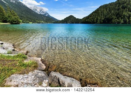 Clear water in a mountain lake. Hintersteiner Lake Tyrol Austria.