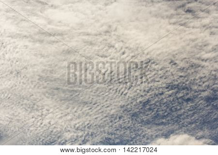 Cirrus clouds in the blue sky.
Cumulus and cirrus clouds illuminated by the sun.