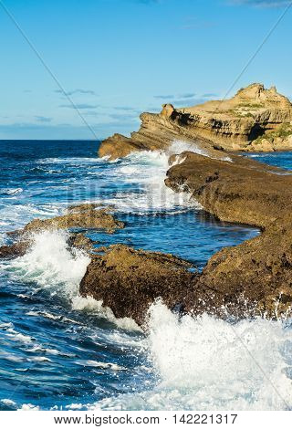 Waves being shop by the reef at Castlepoint New Zealand.
