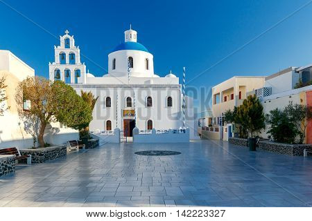 Main white blue orthodox church of Panagia Platsani, in the village of Oia. Santorini.