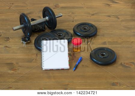 After a workout recording the results and analyzes on the table