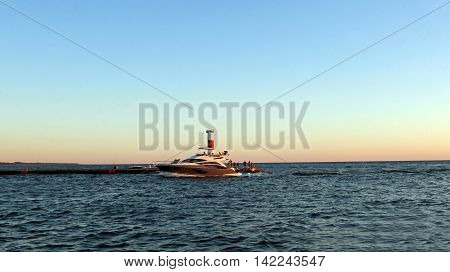 Motor boat in the lake during sunset
